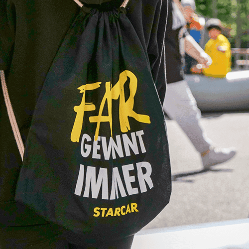 Tragebeutel mit der Aufschrift "Fair gewinnt immer" und dem Starcar Logo.