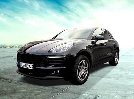Schwarzer Porsche Macan Mietwagen.